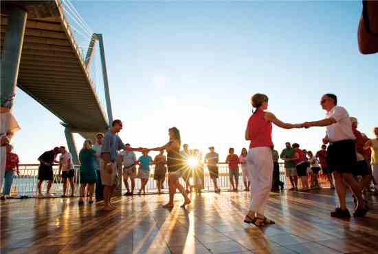 Charleston residents dance on the Mount Pleasant Pier.